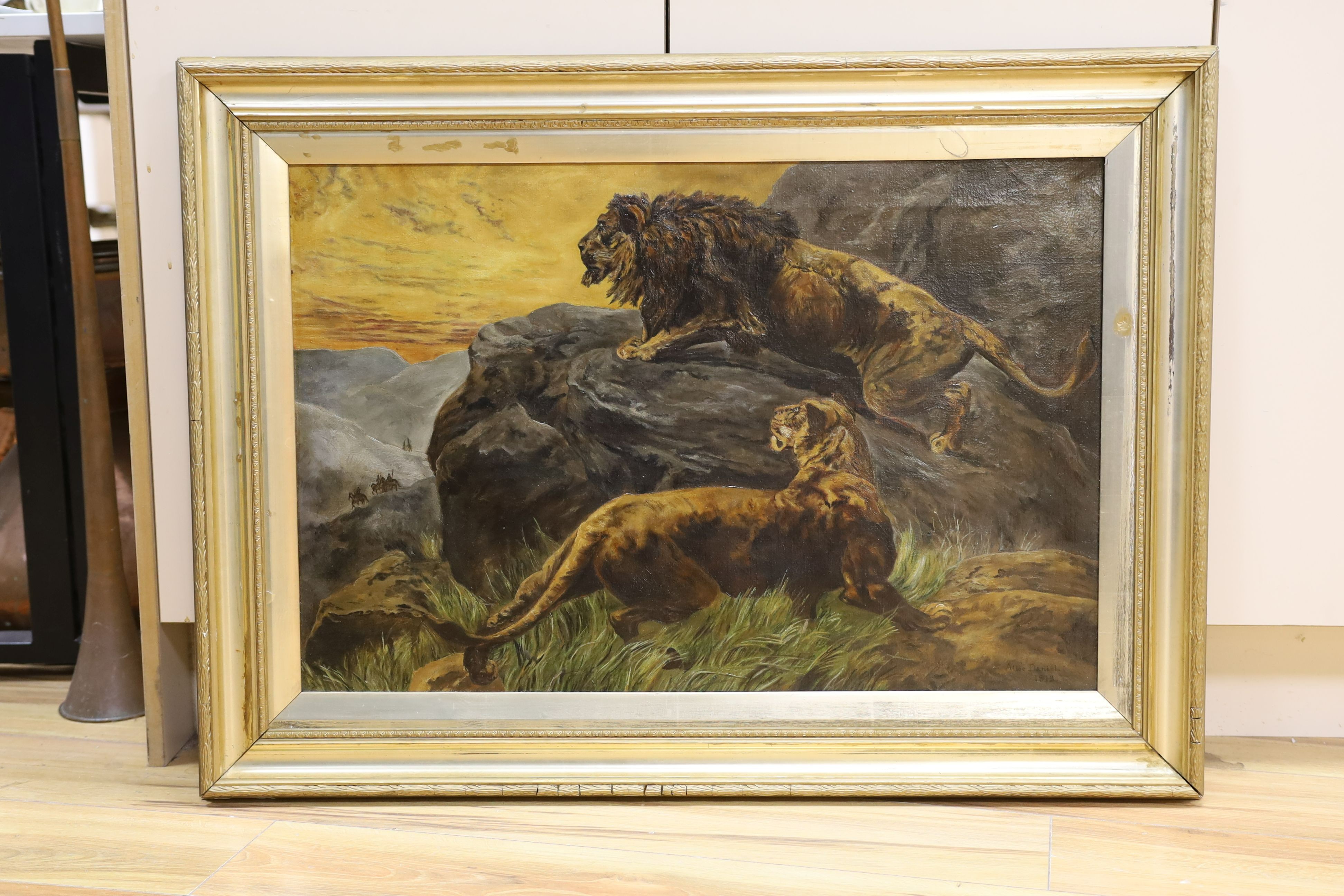 Alice Daniel, oil on canvas, Lions after Herbert Dicksee, signed and dated 1913, 50 x 75cm